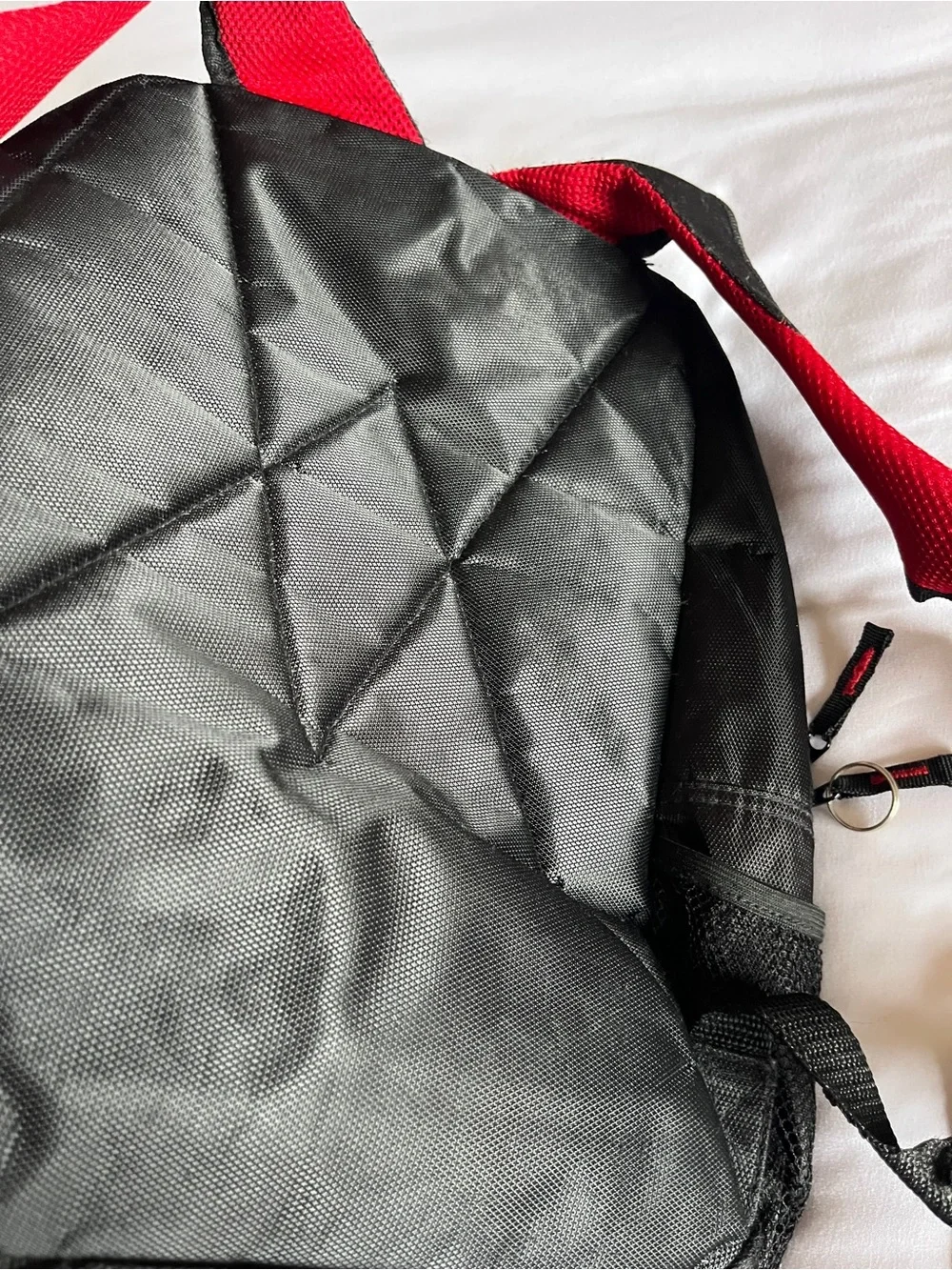 Black & Red Multi-Pocket Backpack with Media Port & Mesh Side Pockets